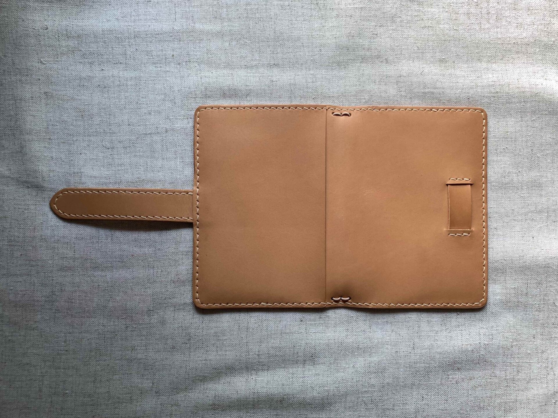 Pocket-size cover with belt closure