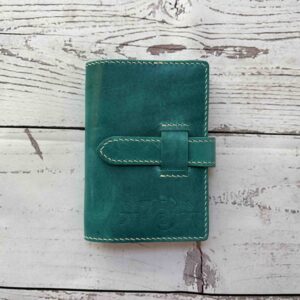 Pocket / passport size cover with belt closure