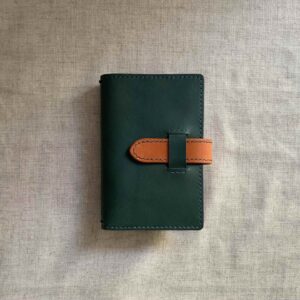 Pocket / passport size cover with belt closure