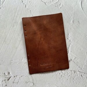 ‘Leather flyleaf with one layer of leather’