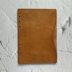 ‘Leather flyleaf with full-length pocket’