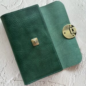 Trifold cover with round lock for Travelers’ notebook