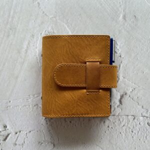 Pocket rings cover with chunky belt closure