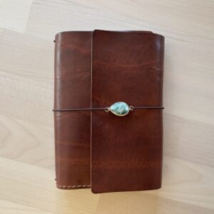 Trifold leather journal for traveling