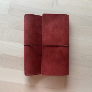 Trifold leather journal with two pockets inside