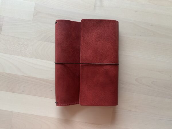 Trifold leather journal with two pockets inside